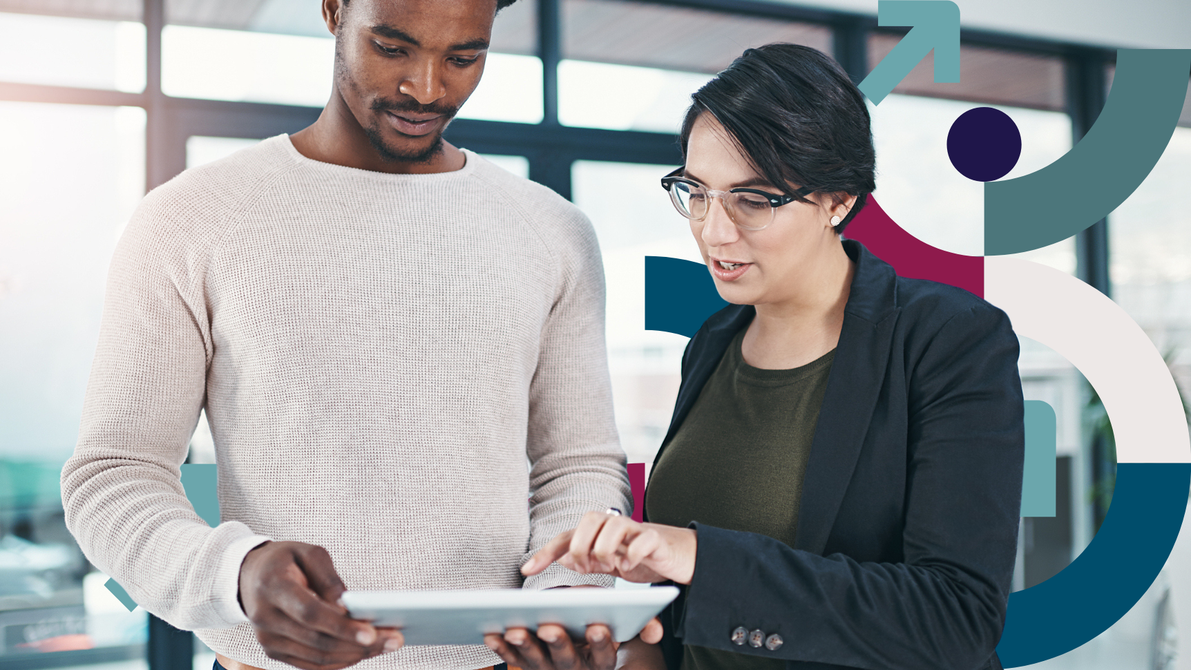 young male and female sales professional looking at the 2025 selling challenges research study on a tablet discussing how this research will impact their plans for the year ahead.