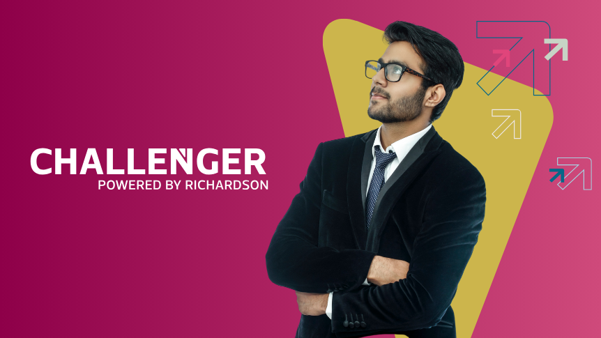 Business man in suit and wearing glasses looks into the distance and thinks about Challenger